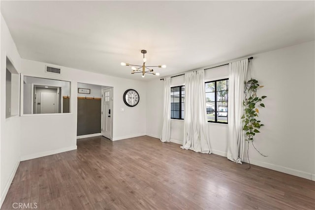 19408 Campaign Dr, Carson, CA 90746 - unfurnished living room with a chandelier and wood finished floors