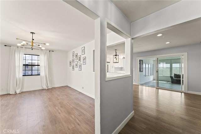 19408 Campaign Dr, Carson, CA 90746 - empty room featuring a chandelier, wood finished floors, plenty of natural light, and recessed lighting