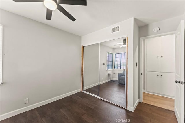 19408 Campaign Dr, Carson, CA 90746 - unfurnished bedroom featuring dark wood-style flooring, a closet, and a ceiling fan