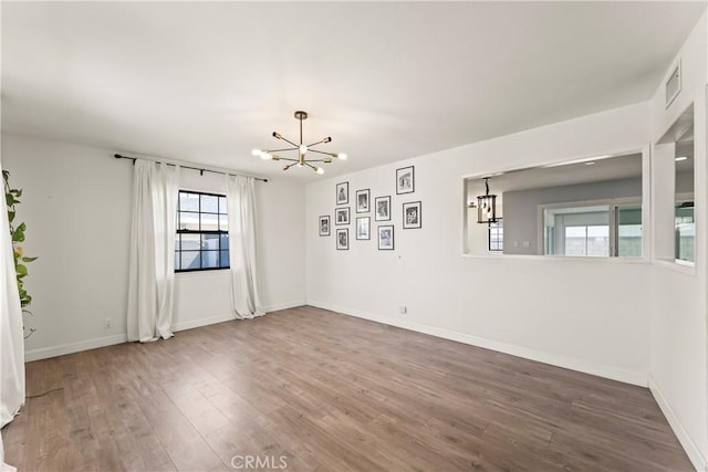 19408 Campaign Dr, Carson, CA 90746 - spare room featuring a chandelier and wood finished floors