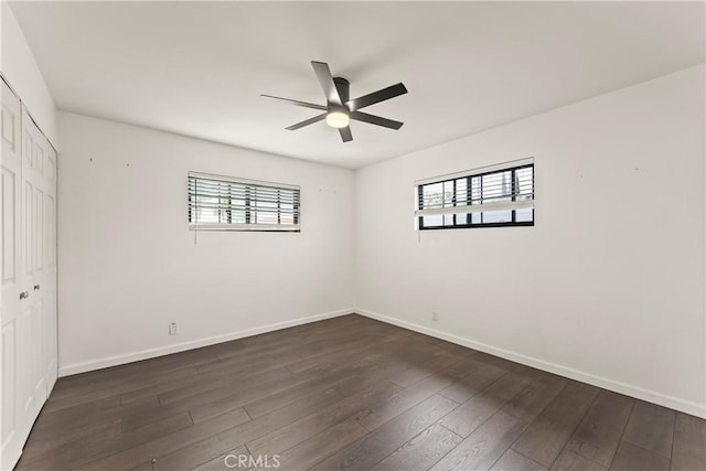 19408 Campaign Dr, Carson, CA 90746 - unfurnished bedroom with multiple windows, dark wood-type flooring, and a closet