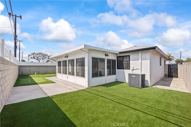 19408 Campaign Dr, Carson, CA 90746 - back of property featuring a sunroom, a fenced backyard, a gate, a patio area, and stucco siding