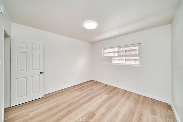 1103 S Hobart Blvd, Los Angeles, CA 90006 - empty room featuring light wood finished floors and baseboards