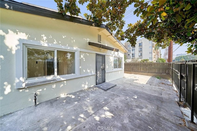 1103 S Hobart Blvd, Los Angeles, CA 90006 - fenced backyard featuring a patio