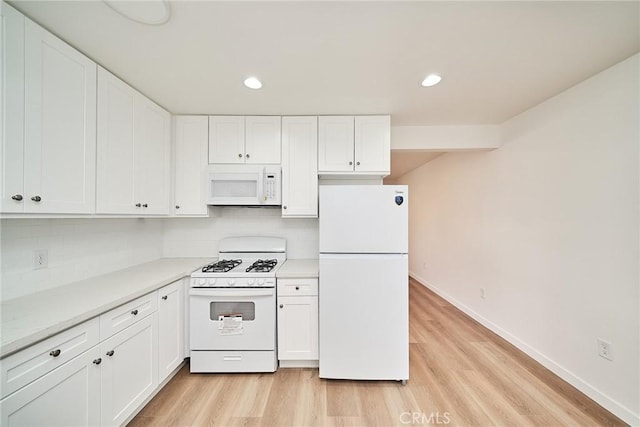 1103 S Hobart Blvd, Los Angeles, CA 90006 - kitchen featuring white appliances, light wood finished floors, backsplash, white cabinets, and light countertops