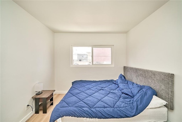 1103 S Hobart Blvd, Los Angeles, CA 90006 - bedroom with wood finished floors and baseboards