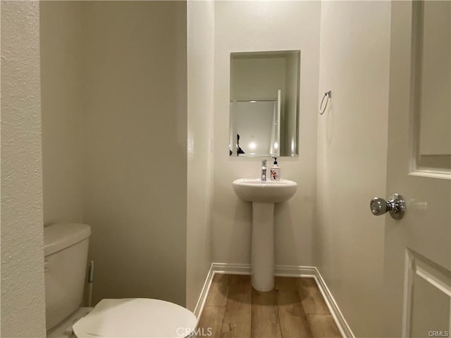 265 N Standard Ave, Santa Ana, CA 92701 - bathroom with toilet and wood finished floors