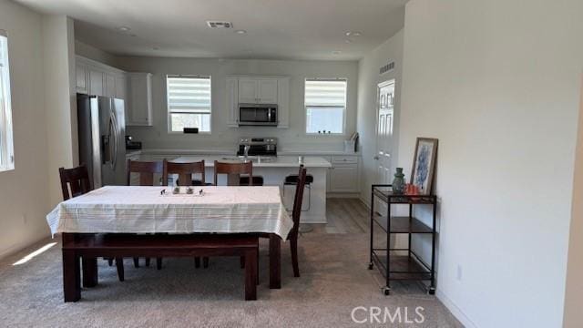 265 N Standard Ave, Santa Ana, CA 92701 - dining area with healthy amount of natural light and light carpet