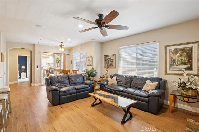 15 Ardmore, Irvine, CA 92602 - living room featuring arched walkways, a ceiling fan, light wood-type flooring, and recessed lighting