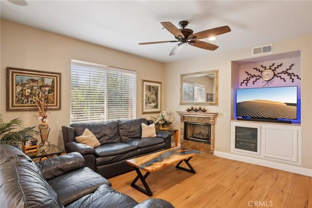 15 Ardmore, Irvine, CA 92602 - living room with light wood-style flooring, ceiling fan, and a premium fireplace