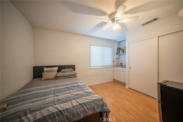 8936 Summerwood Way, Fontana, CA 92335 - bedroom featuring light wood finished floors, a ceiling fan, and a closet