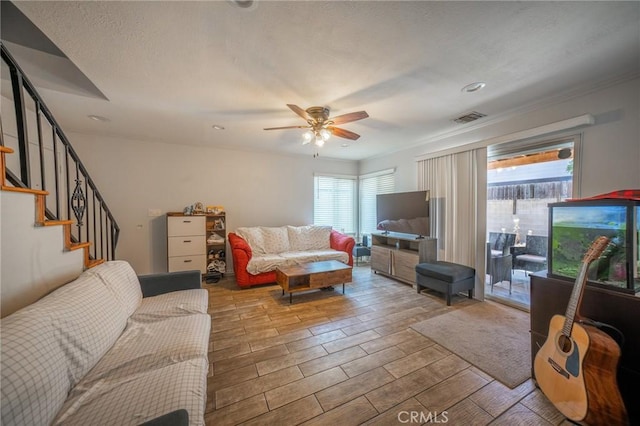 8936 Summerwood Way, Fontana, CA 92335 - living room with ceiling fan, stairs, and wood finished floors