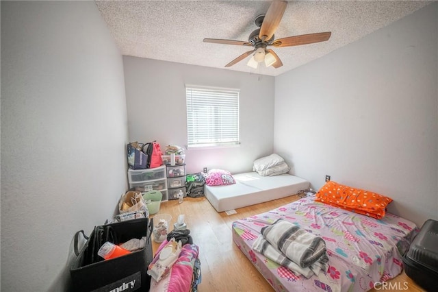 8936 Summerwood Way, Fontana, CA 92335 - bedroom with a textured ceiling, wood finished floors, and a ceiling fan