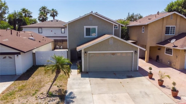 8936 Summerwood Way, Fontana, CA 92335 - traditional-style home featuring concrete driveway, stucco siding, and a garage