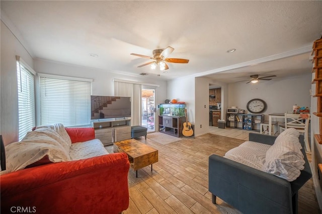 8936 Summerwood Way, Fontana, CA 92335 - living area featuring ceiling fan, ornamental molding, and light wood-style floors