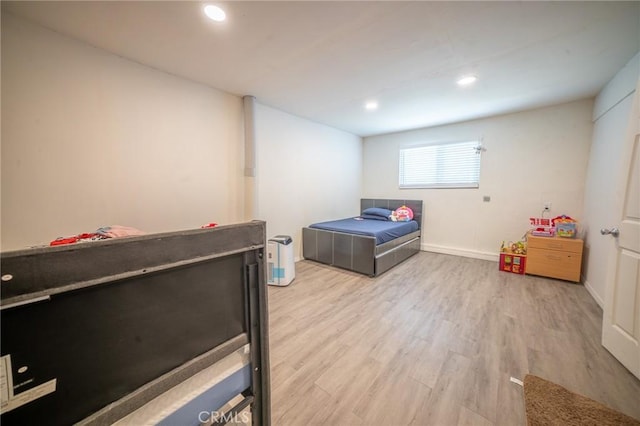 8936 Summerwood Way, Fontana, CA 92335 - bedroom with light wood-style flooring and recessed lighting