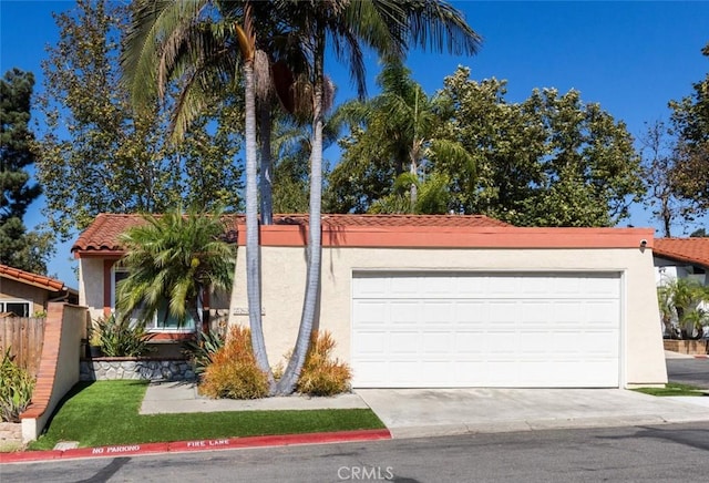 26645 Paseo Ensenada, San Juan Capistrano, CA 92675 - view of front of house featuring stucco siding, a tiled roof, and driveway
