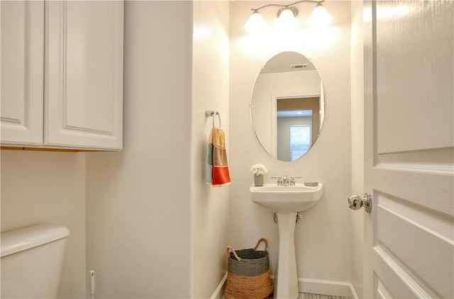 3591 Sacramento Dr Unit 50, San Luis Obispo, CA 93401 - half bathroom featuring toilet and baseboards