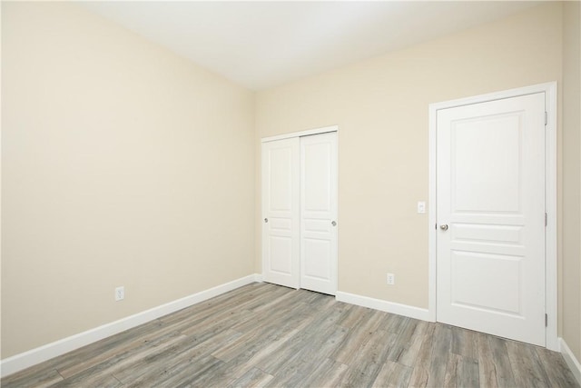 3591 Sacramento Dr Unit 50, San Luis Obispo, CA 93401 - unfurnished bedroom featuring light wood finished floors and a closet