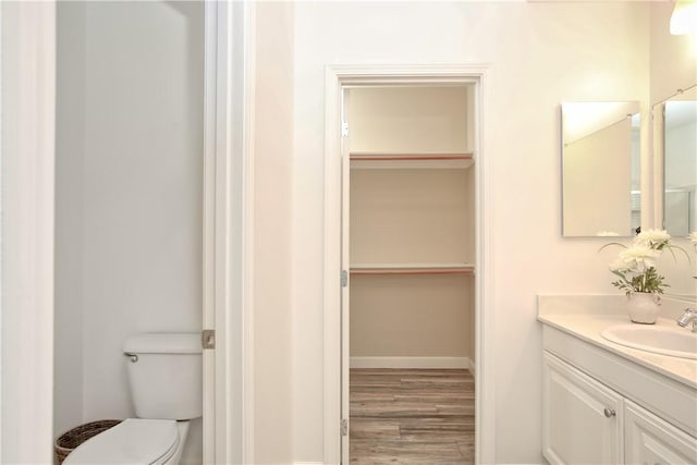 3591 Sacramento Dr Unit 50, San Luis Obispo, CA 93401 - bathroom with vanity, wood finished floors, and a walk in closet