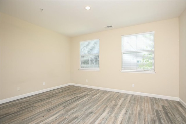 3591 Sacramento Dr Unit 50, San Luis Obispo, CA 93401 - empty room with wood finished floors and recessed lighting