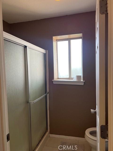 7653 Phelan Rd, Phelan, CA 92371 - full bathroom featuring tile patterned flooring and a shower stall