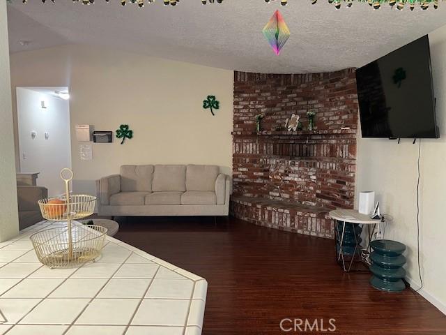 7653 Phelan Rd, Phelan, CA 92371 - living room with wood finished floors and a textured ceiling