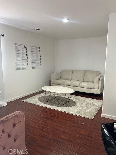 7653 Phelan Rd, Phelan, CA 92371 - living room with baseboards and wood finished floors