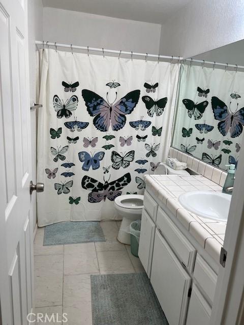 7653 Phelan Rd, Phelan, CA 92371 - full bathroom featuring vanity and a shower with curtain