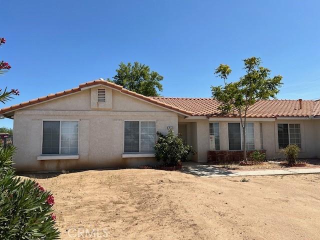 7653 Phelan Rd, Phelan, CA 92371 - view of front of home with stucco siding and a tile roof