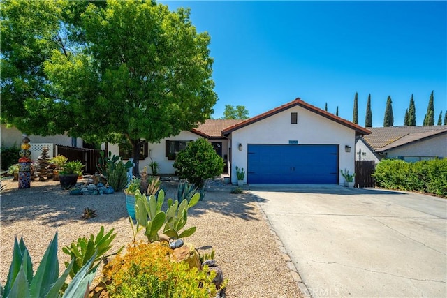 1024 Rachel Ln, Paso Robles, CA 93446 - view of front of home with stucco siding, an attached garage, concrete driveway, and a tiled roof