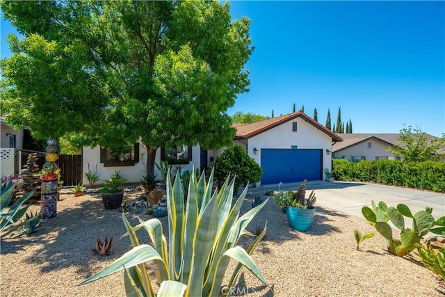 1024 Rachel Ln, Paso Robles, CA 93446 - view of front of house featuring stucco siding, driveway, and a garage