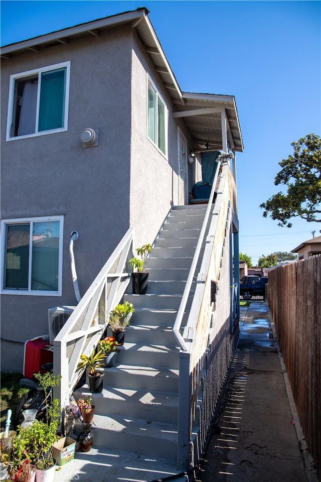 2913 Illinois Ave, South Gate, CA 90280 - view of side of property featuring stairway and stucco siding