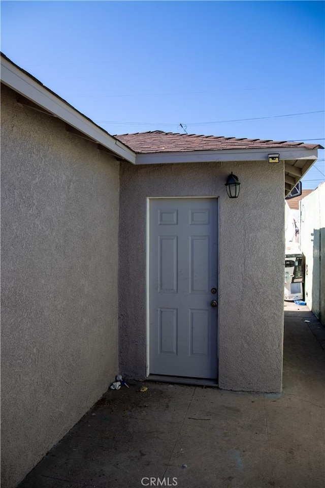2913 Illinois Ave, South Gate, CA 90280 - doorway to property featuring stucco siding