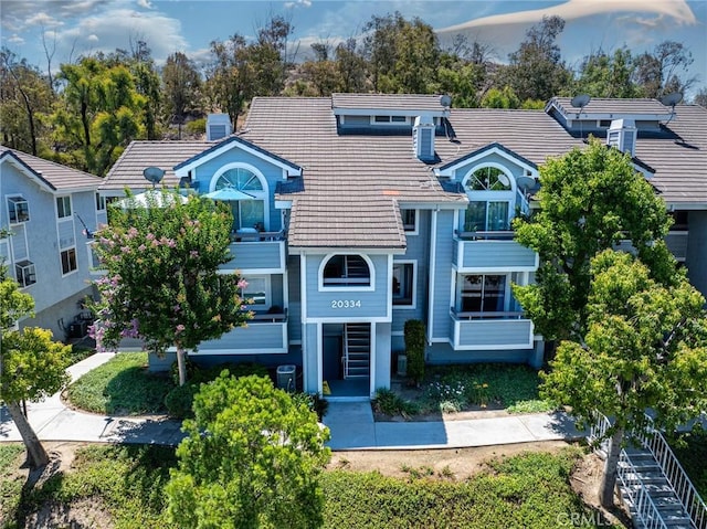 20334 Rue Crevier Unit 621, Canyon Country, CA 91351 - view of front of home featuring a balcony and a tile roof