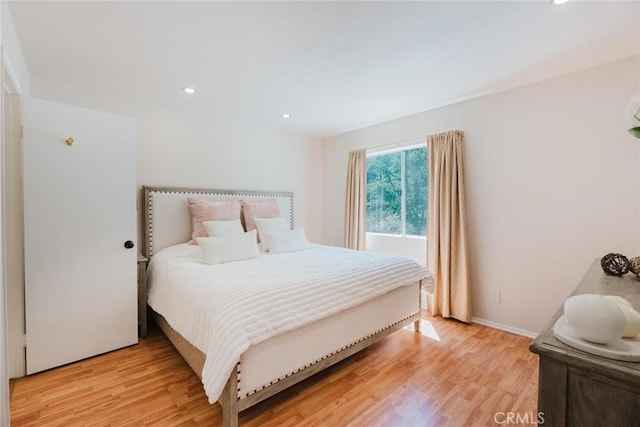 20334 Rue Crevier Unit 621, Canyon Country, CA 91351 - bedroom with light wood-type flooring and recessed lighting