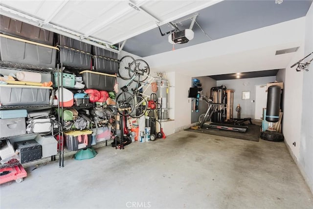 20334 Rue Crevier Unit 621, Canyon Country, CA 91351 - garage featuring secured water heater and a garage door opener