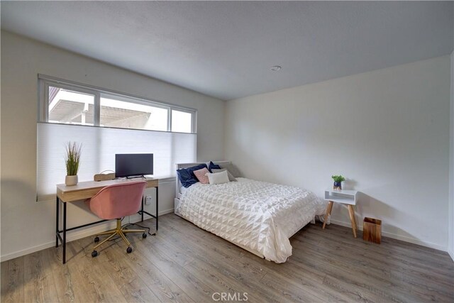 641 Piney Way Unit D, Morro Bay, CA 93442 - bedroom with wood finished floors and a desk