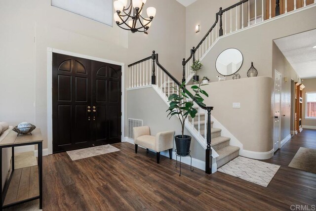 2270 Ritter Pl, Escondido, CA 92029 - entrance foyer with stairs, wood finished floors, a chandelier, and a high ceiling