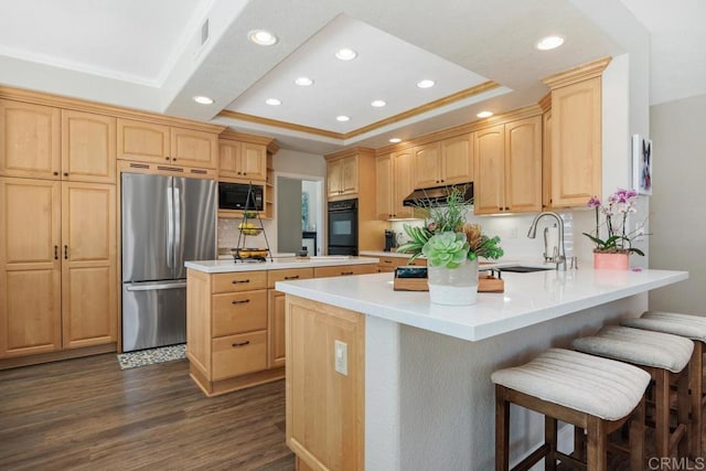 2270 Ritter Pl, Escondido, CA 92029 - kitchen featuring black appliances, light brown cabinets, a raised ceiling, under cabinet range hood, and a peninsula
