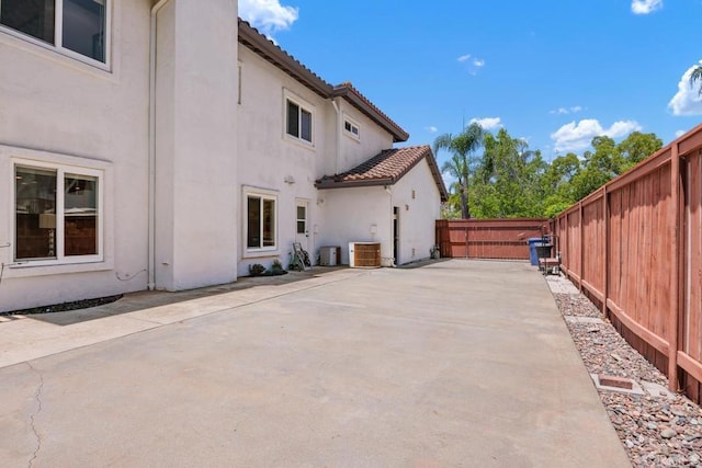 2270 Ritter Pl, Escondido, CA 92029 - view of home's exterior featuring stucco siding, a patio, a fenced backyard, and a tile roof