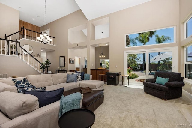 2270 Ritter Pl, Escondido, CA 92029 - living room featuring a chandelier, a towering ceiling, stairway, and carpet flooring