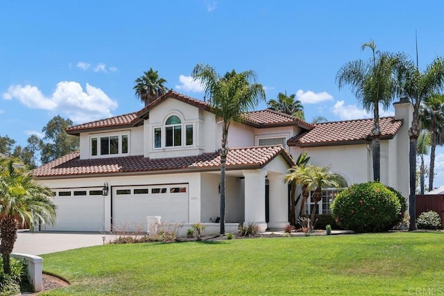 2270 Ritter Pl, Escondido, CA 92029 - mediterranean / spanish-style house featuring a front lawn, stucco siding, concrete driveway, and an attached garage