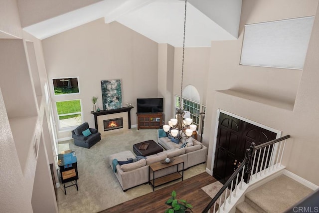 2270 Ritter Pl, Escondido, CA 92029 - living area featuring high vaulted ceiling, a chandelier, a glass covered fireplace, stairway, and beamed ceiling