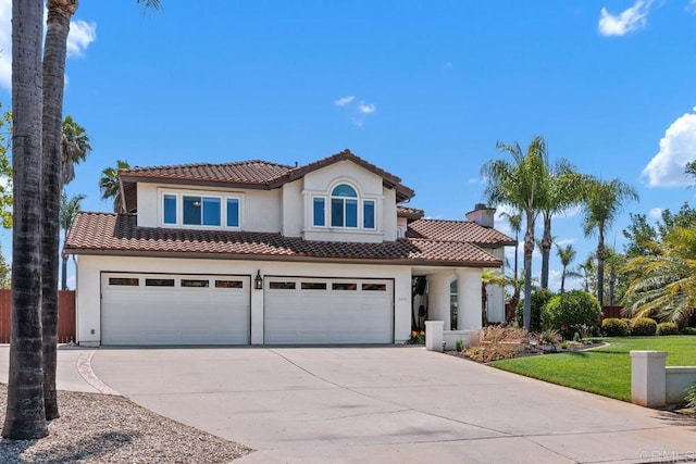 2270 Ritter Pl, Escondido, CA 92029 - mediterranean / spanish-style home featuring a tiled roof, concrete driveway, a garage, and stucco siding