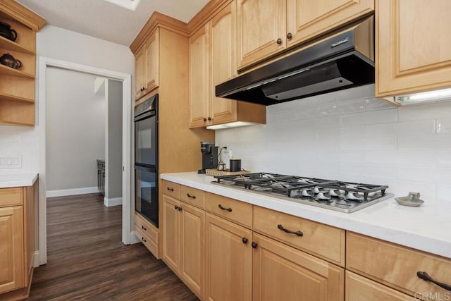 2270 Ritter Pl, Escondido, CA 92029 - kitchen with under cabinet range hood, stainless steel gas cooktop, light countertops, and tasteful backsplash