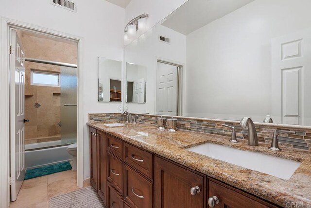 2270 Ritter Pl, Escondido, CA 92029 - full bathroom with double vanity, combined bath / shower with glass door, and tile patterned flooring