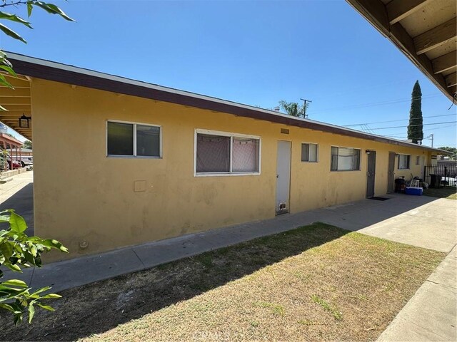 438 W Ramona Dr, Rialto, CA 92376 - view of front facade featuring stucco siding