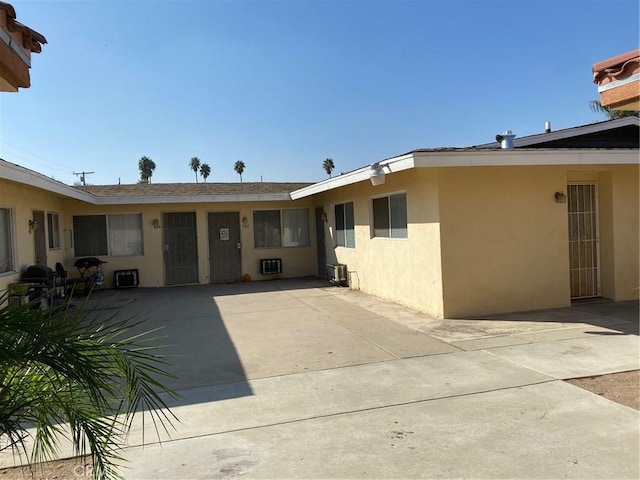 438 W Ramona Dr, Rialto, CA 92376 - entrance to property with stucco siding and a patio