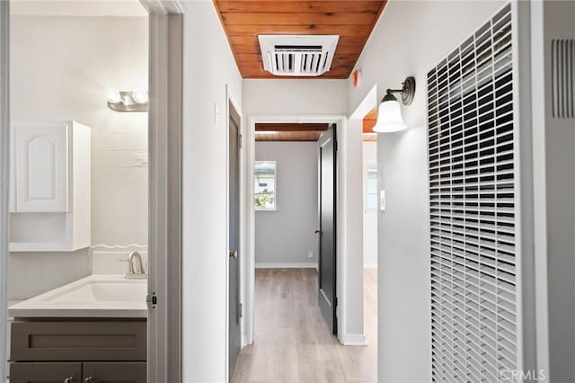 1625 Rose Ave, Merced, CA 95341 - hall featuring a heating unit, light wood finished floors, and wooden ceiling